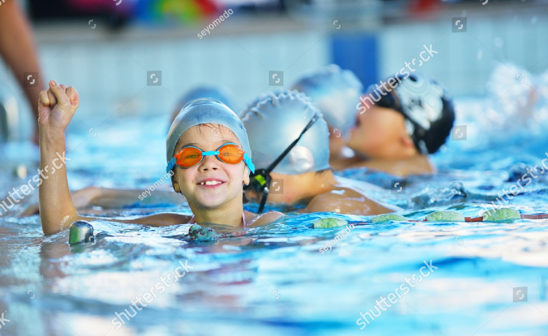 stock-photo-happy-children-kids-group-at-swimming-pool-class-learning-to-swim-248927899