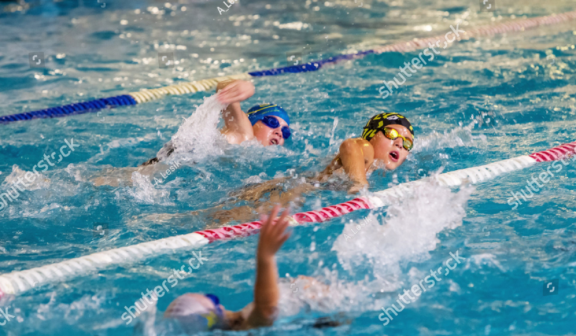 _stock-photo-odessa-ukraine-cirka-children-athletes-swimmers-swim-along-tracks-in-sports-pool-for-1199249962